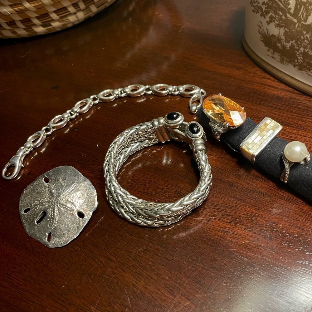 Assortment of sterling silver jewelry all bought in Charleston SC.